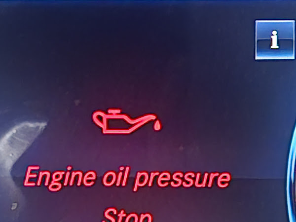 Car dashboard warning light displaying "Engine oil pressure — Stop — Switch off engine", indicating a critical engine fault requiring immediate roadside recovery